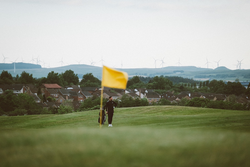 View of Playsport Golf course green and golfer in East Kilbride